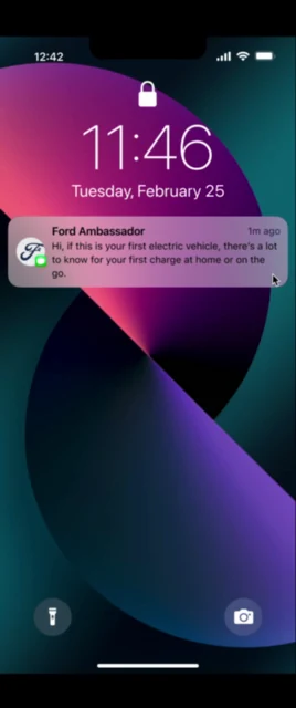 A Ford Ambassador text arriving on an iPhone lock screen